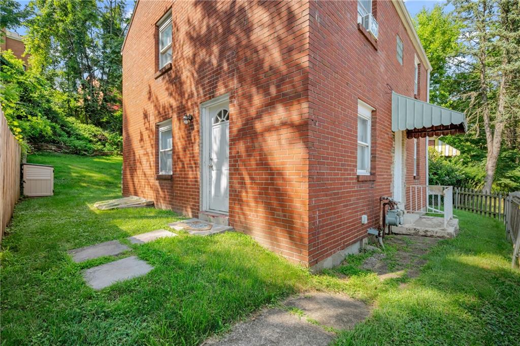 1627-1629 Laketon Road Pittsburgh, PA 15221 - Photo 3 of 26 a backyard of a house with lots of green space