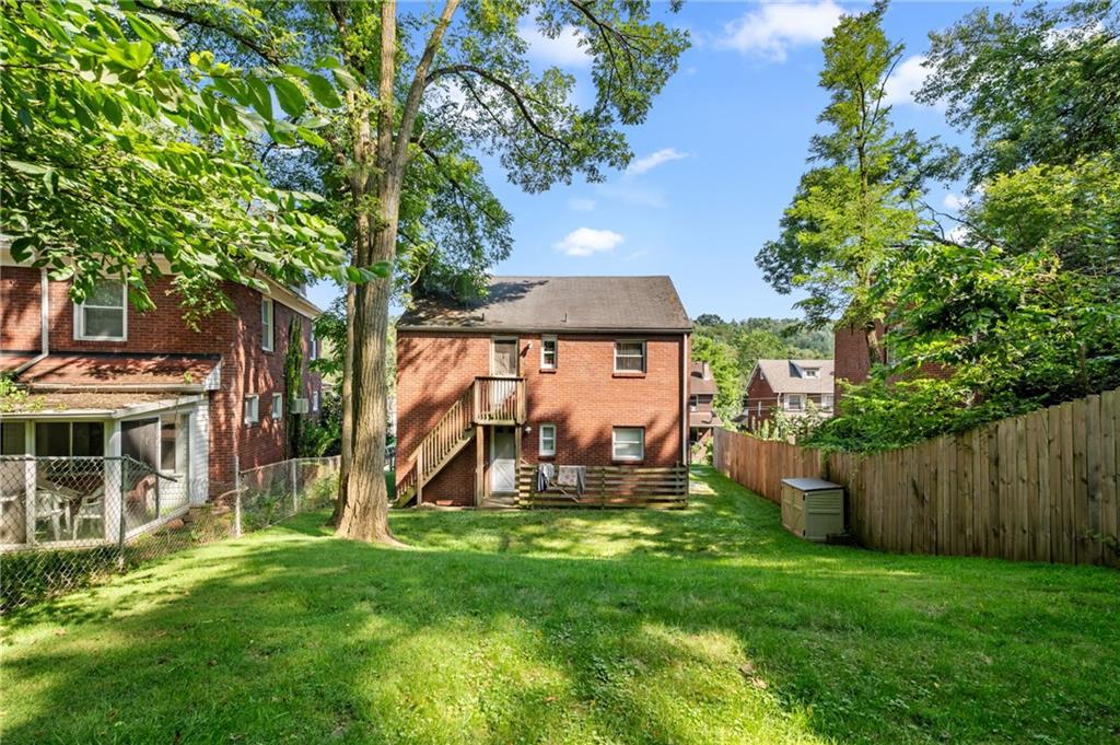 1627-1629 Laketon Road Pittsburgh, PA 15221 - Photo 4 of 26 a view of a house with a backyard