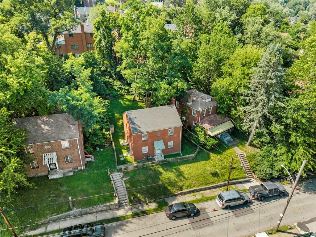 1627-1629 Laketon Road Pittsburgh, PA 15221 - Photo 8 of 26 an aerial view of a house with a yard and lake view