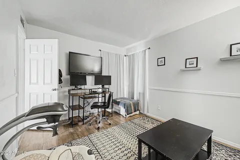 a workspace with furniture and a window