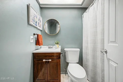 a white toilet sitting next to a small bathroom