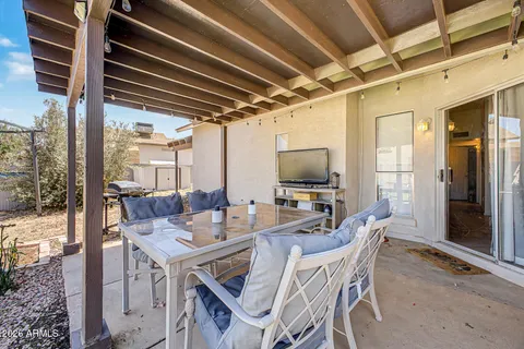 a view of an outside dining space with furniture