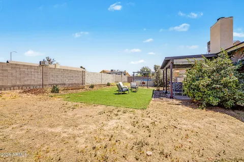 a view of a garden with a house