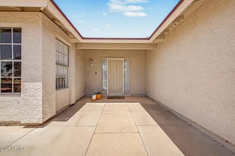 a view of an empty room with a small entryway