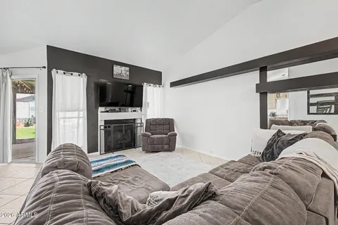 a bedroom with a bed and flat screen tv