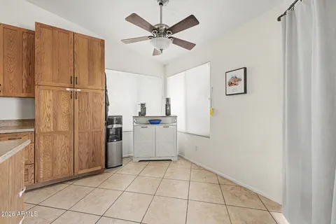 a kitchen with a refrigerator and cabinets