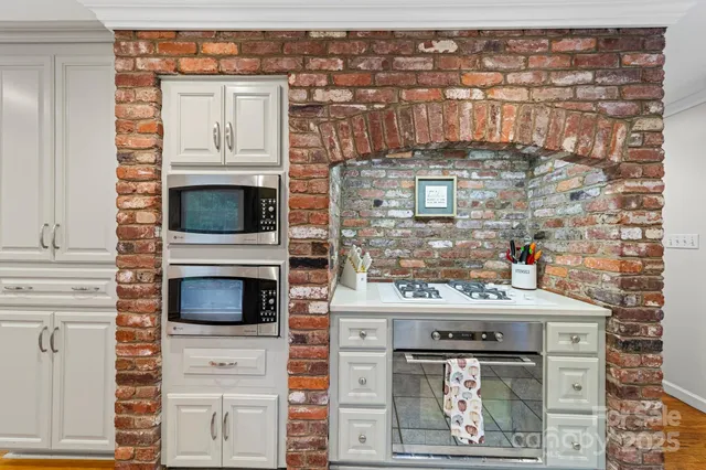 a kitchen with a stove and a microwave