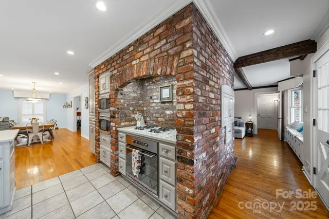 a kitchen with stainless steel appliances granite countertop a refrigerator sink and cabinets