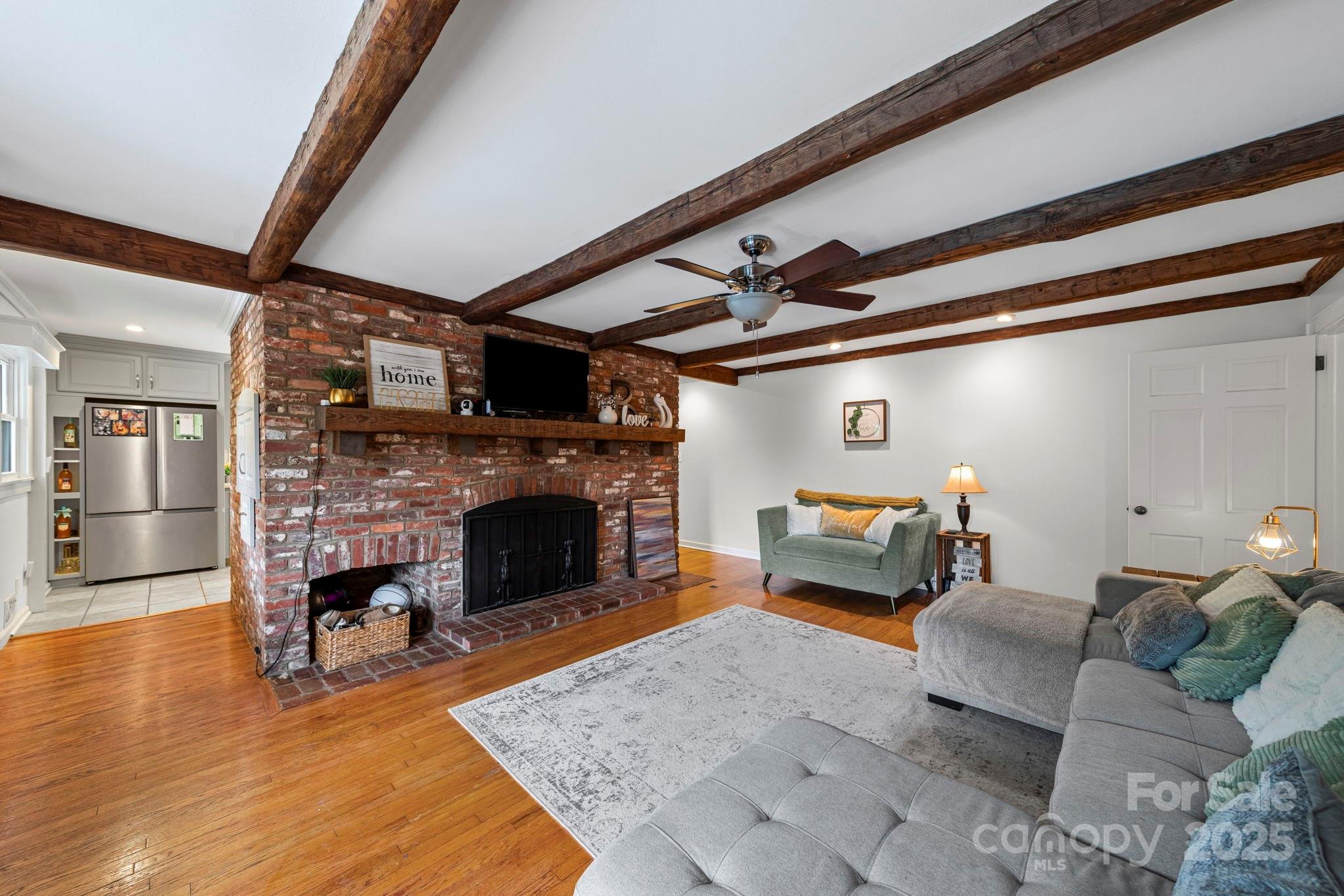 417 Park Ridge Road Albemarle, NC 28001 - Photo 19 of 48 a living room with furniture and a fireplace