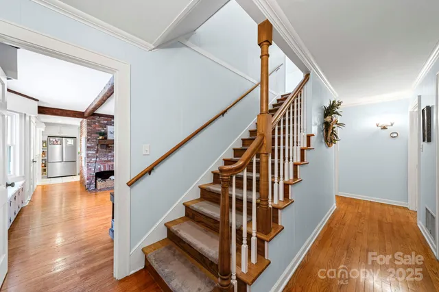 a bedroom with a bed and a ceiling fan