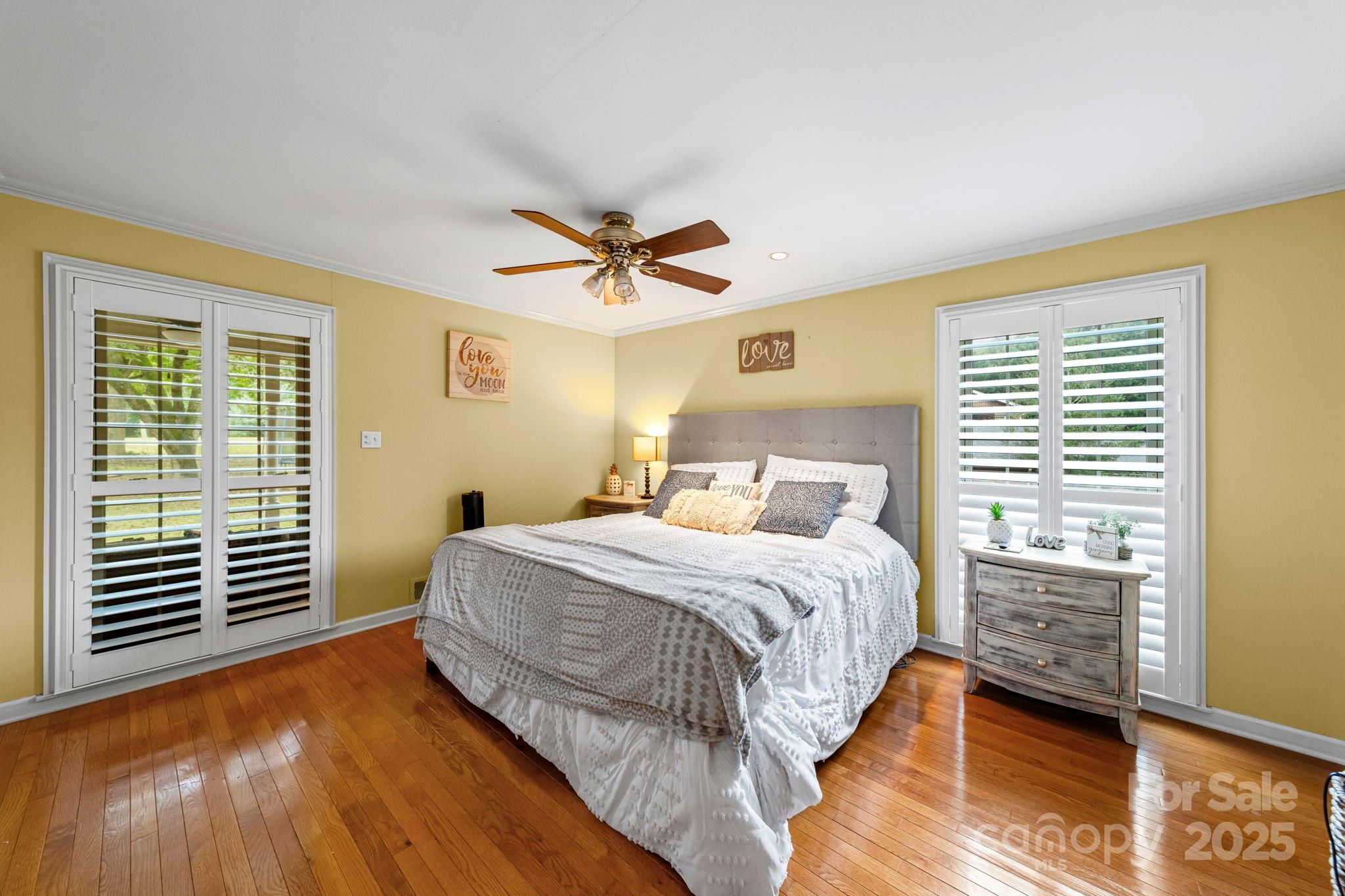 417 Park Ridge Road Albemarle, NC 28001 - Photo 21 of 48 a bedroom with a bed and a ceiling fan