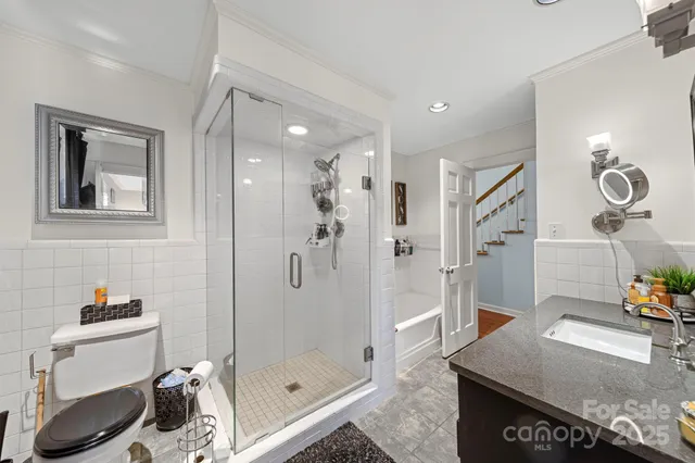 a bathroom with a sink and shower