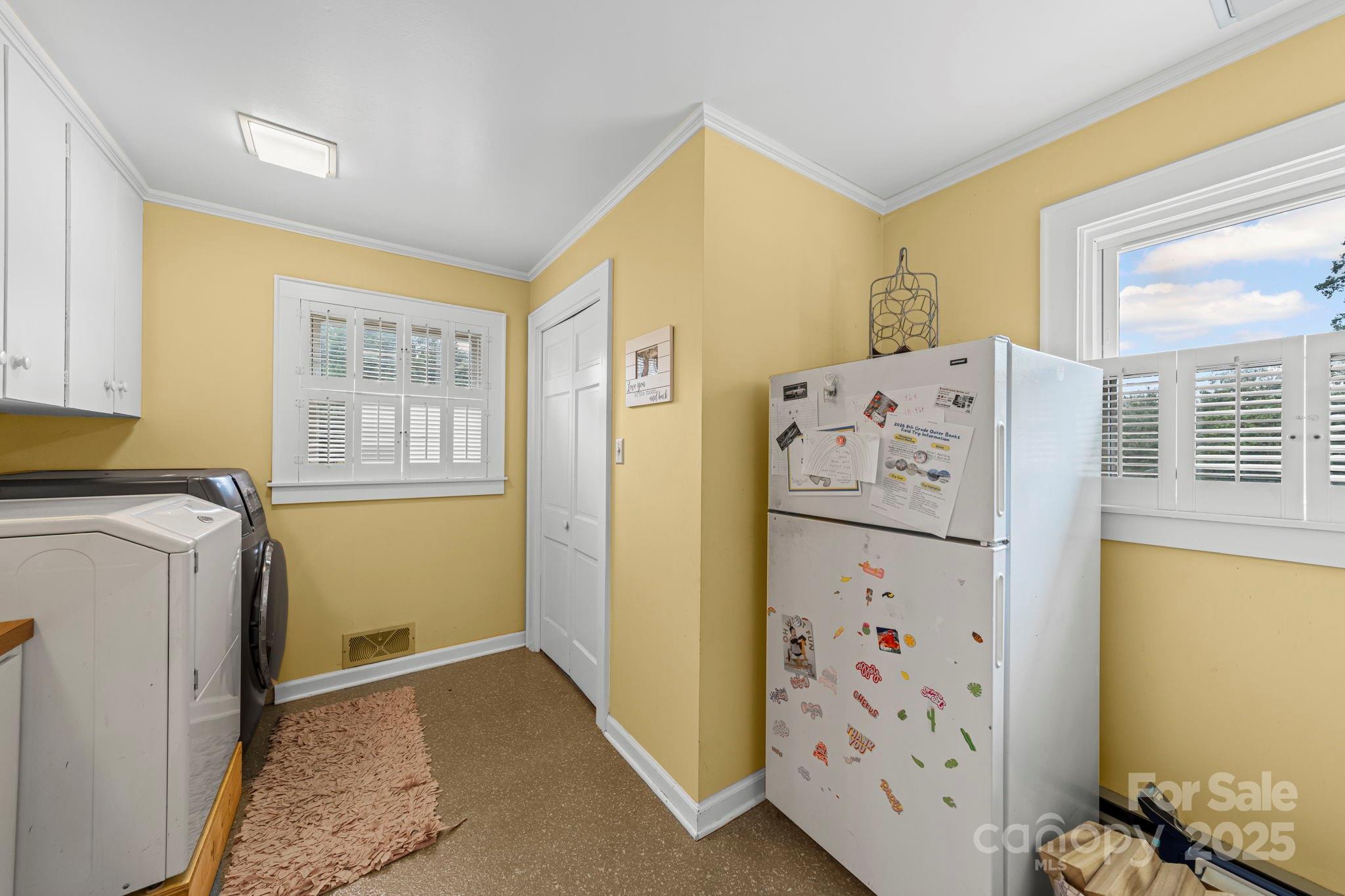 417 Park Ridge Road Albemarle, NC 28001 - Photo 27 of 48 a utility room with refrigerator a washer and dryer