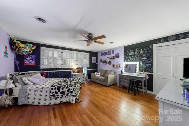 a bedroom with a bed and furniture