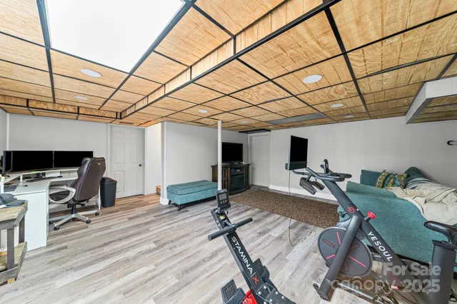 an aerial view of a house with swimming pool garden and patio