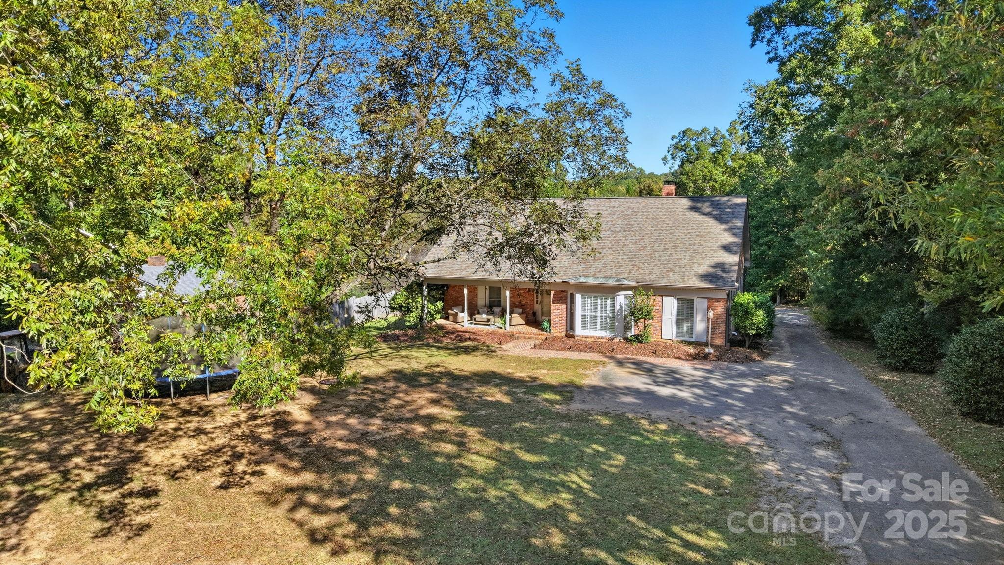 417 Park Ridge Road Albemarle, NC 28001 - Photo 4 of 48 a front view of a house with a garden