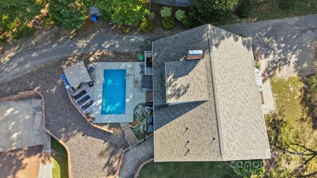 a view of a backyard with sitting area