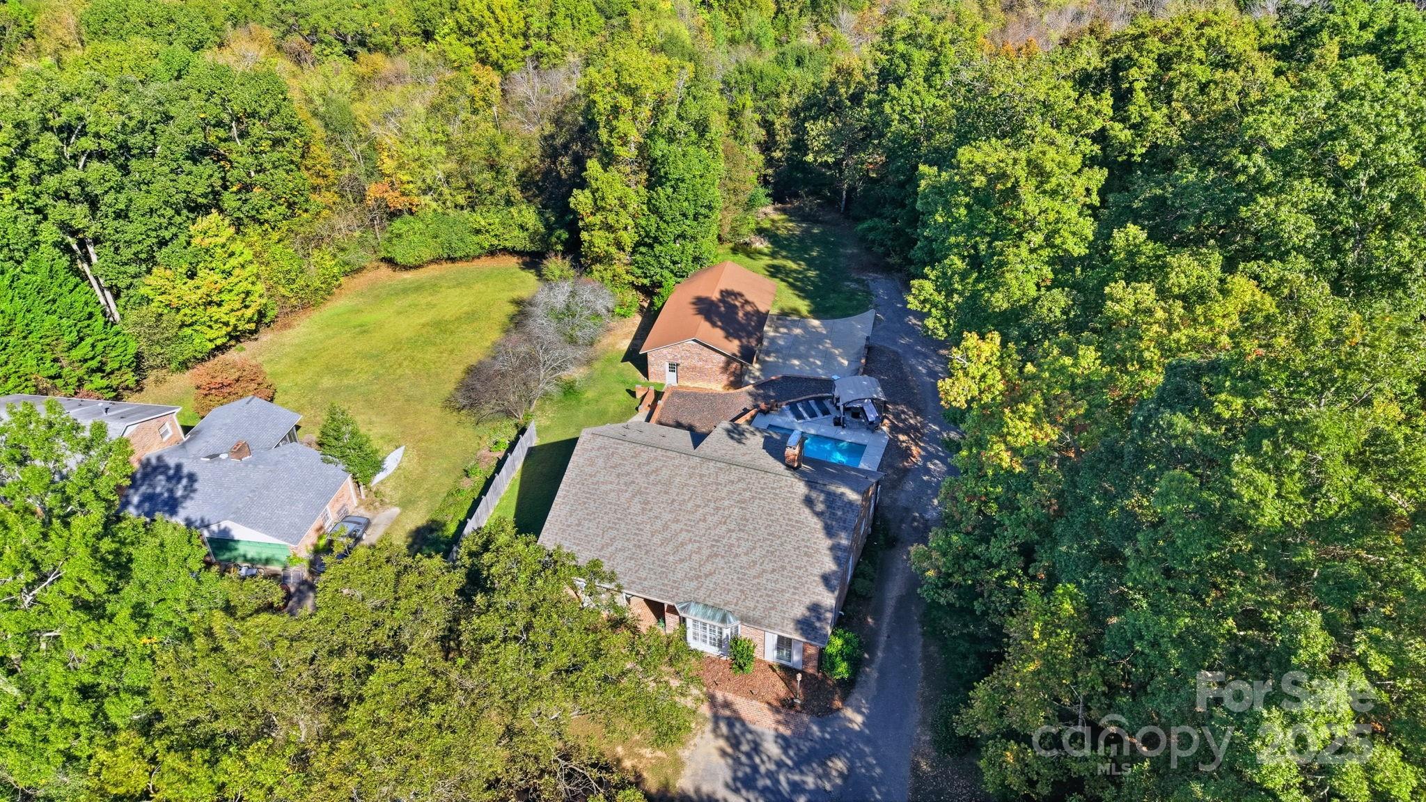 417 Park Ridge Road Albemarle, NC 28001 - Photo 44 of 48 an aerial view of a house with a yard and trees