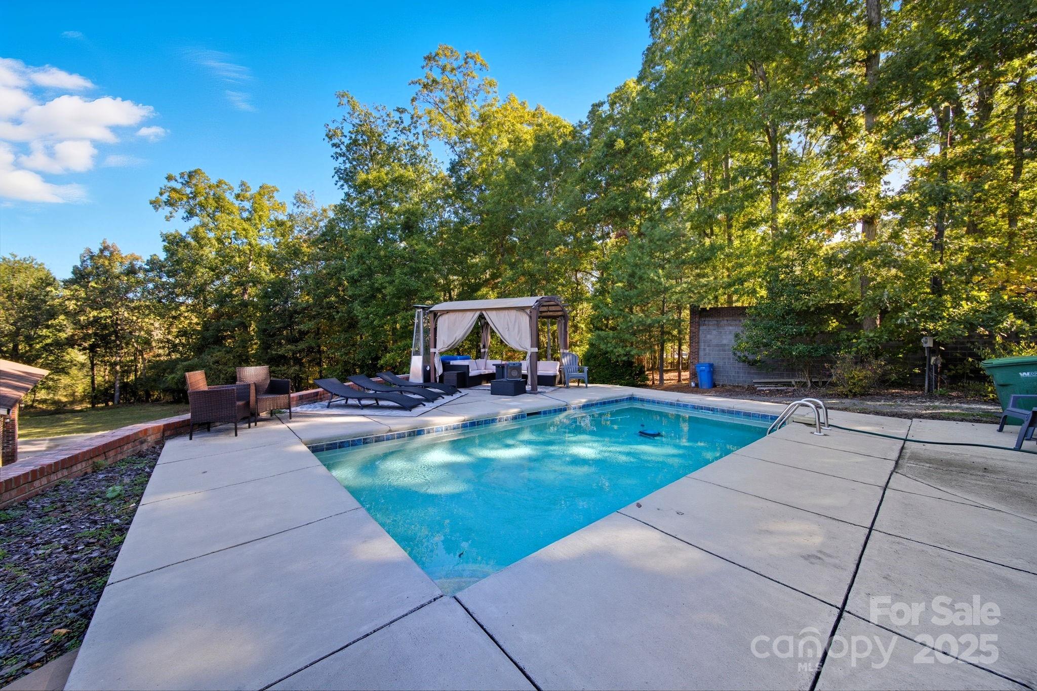 417 Park Ridge Road Albemarle, NC 28001 - Photo 45 of 48 a view of a backyard with sitting area