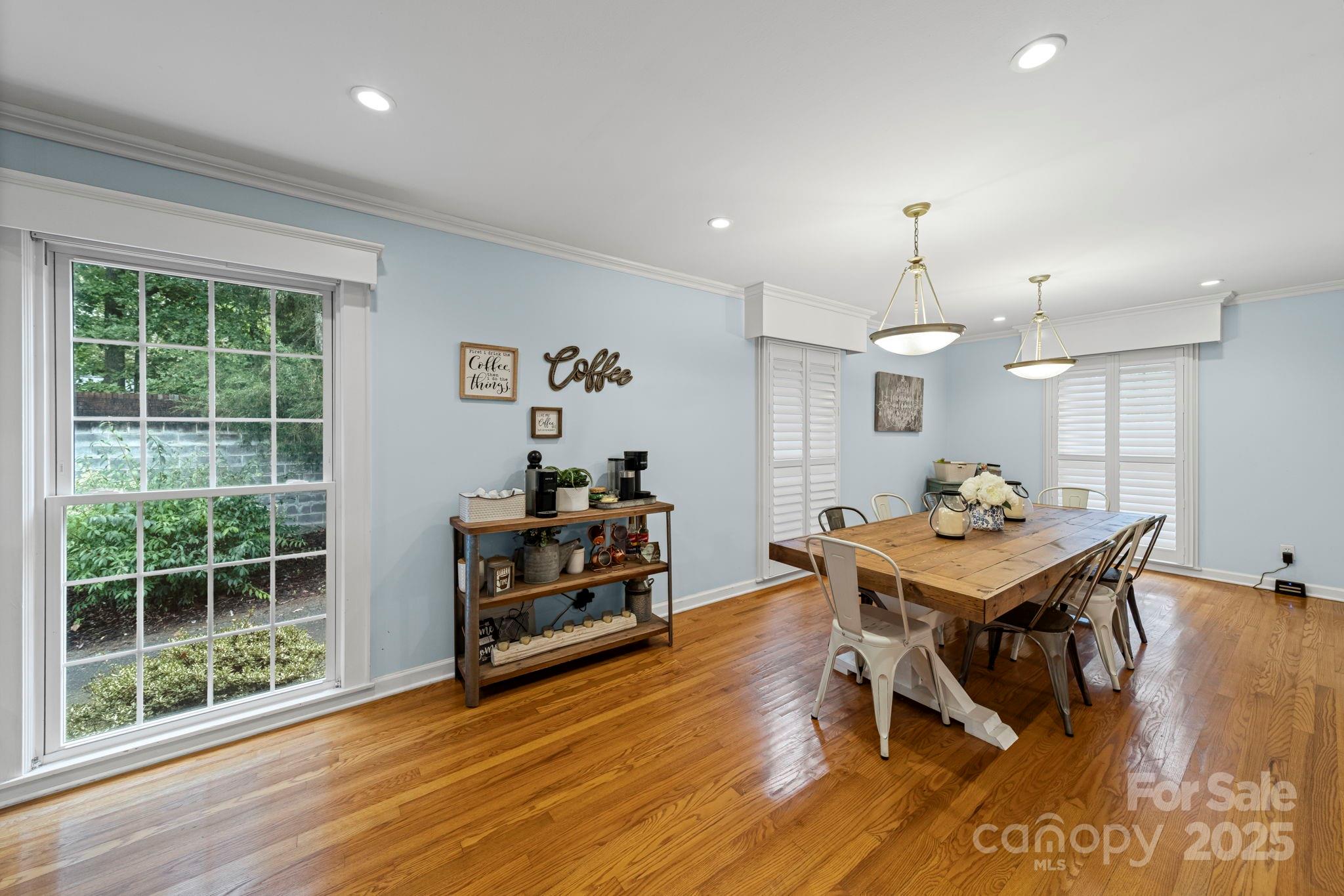 417 Park Ridge Road Albemarle, NC 28001 - Photo 10 of 48 a view of a dining room with furniture and wooden floor