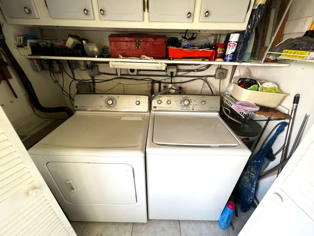 a utility room with dryer and washer