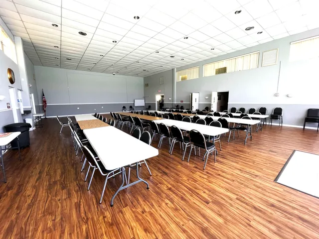 a living room with lots of furniture and wooden floors