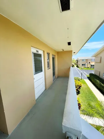 a view of a living room hardwood and a kitchen