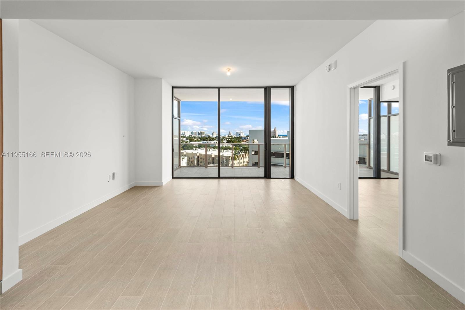 500 Alton Road, Unit 908 Miami Beach, FL 33139 - Photo 16 of 28 wooden floor in an empty room with a window