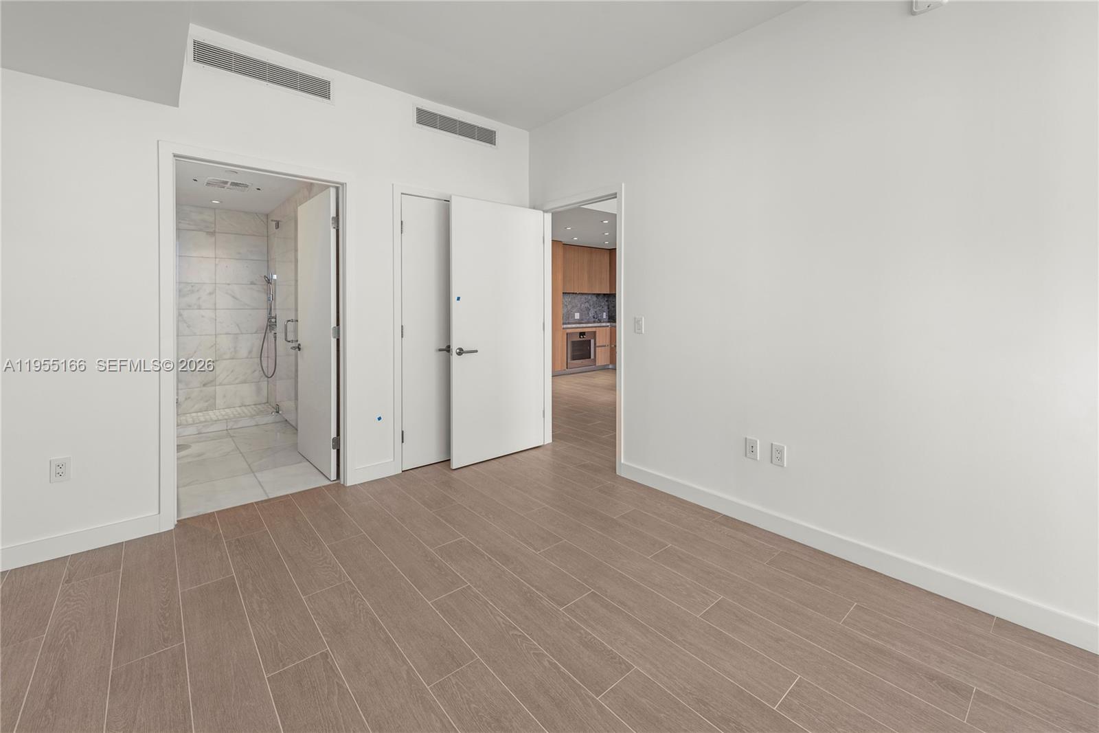 500 Alton Road, Unit 908 Miami Beach, FL 33139 - Photo 20 of 28 wooden floor in an empty room