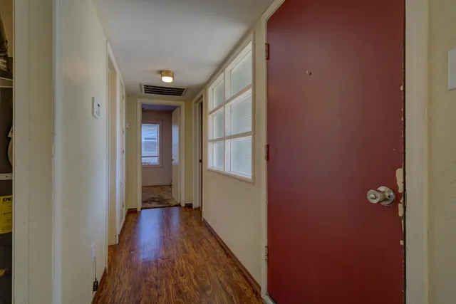 a workspace room with furniture and chandelier
