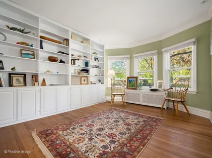 a living room filled with furniture and a rug