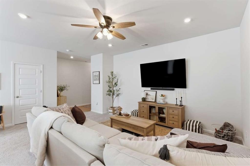 91 Pinnacle Way Jasper, GA 30143 - Photo 11 of 37 a living room with furniture and a flat screen tv