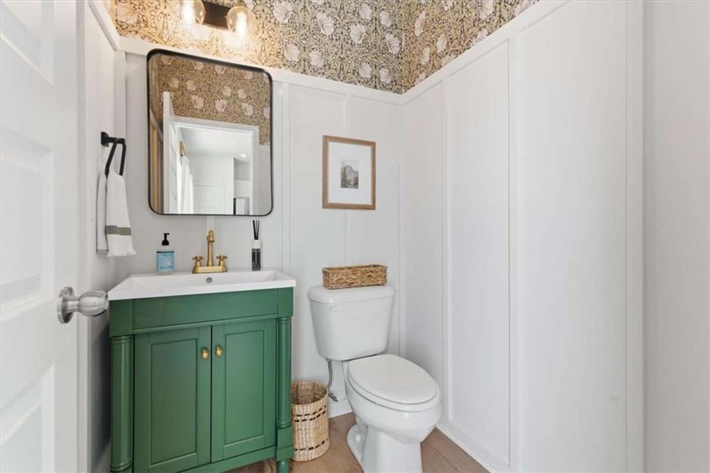 91 Pinnacle Way Jasper, GA 30143 - Photo 17 of 37 a bathroom with a toilet sink vanity and mirror