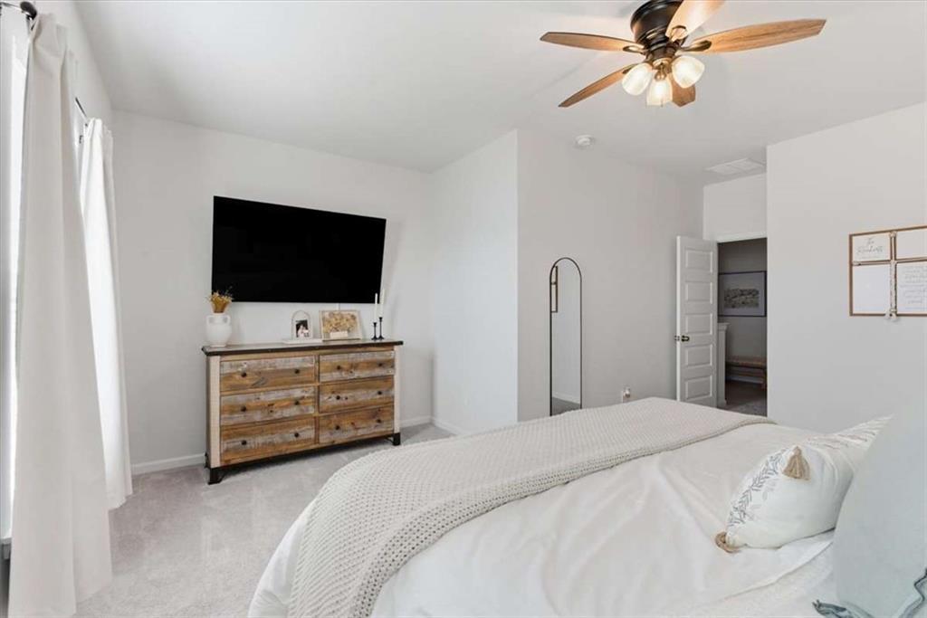 91 Pinnacle Way Jasper, GA 30143 - Photo 22 of 37 a bedroom with a bed and a flat screen tv