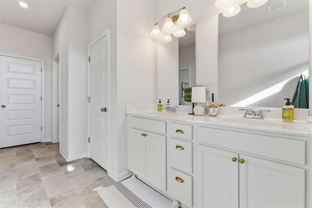 91 Pinnacle Way Jasper, GA 30143 - Photo 25 of 37 a bathroom with a double vanity sink mirror and vanity