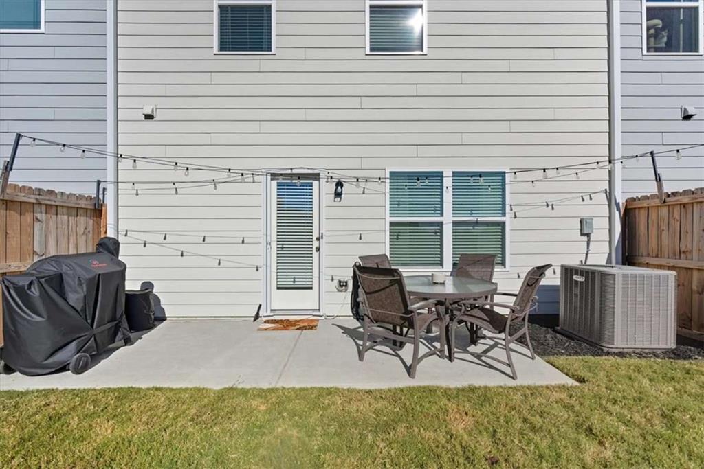 91 Pinnacle Way Jasper, GA 30143 - Photo 30 of 37 a view of backyard with seating space and wooden fence