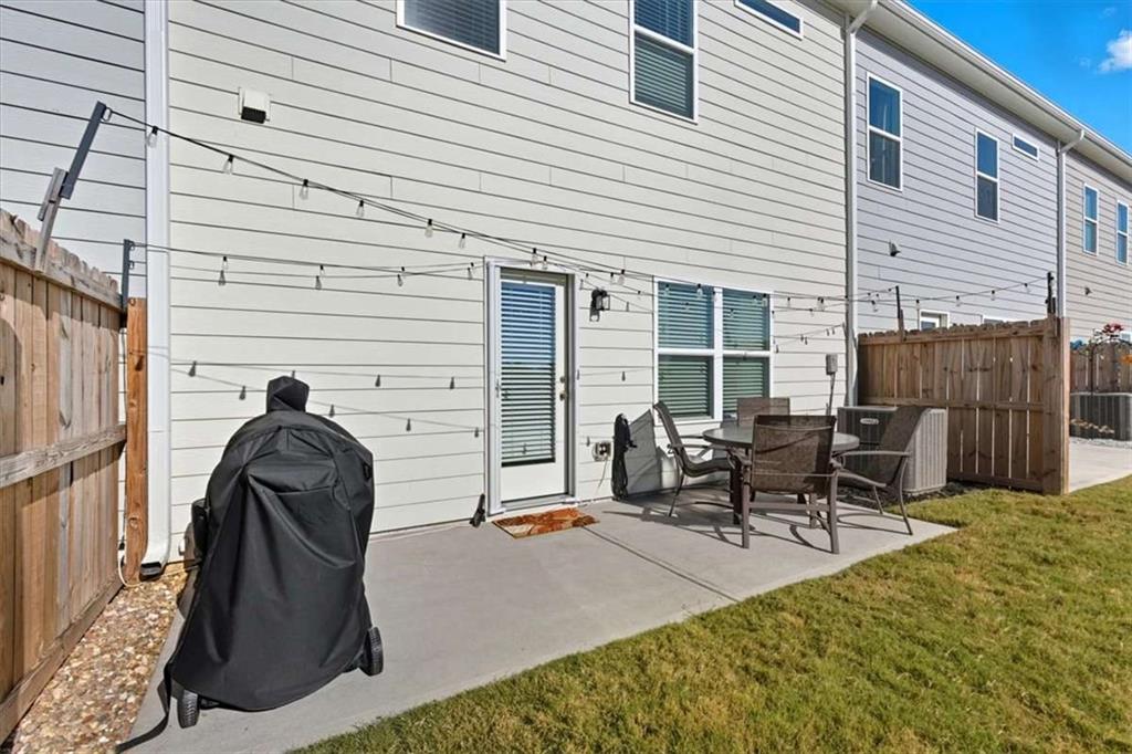 91 Pinnacle Way Jasper, GA 30143 - Photo 31 of 37 a view of a patio with table and chairs and wooden floor