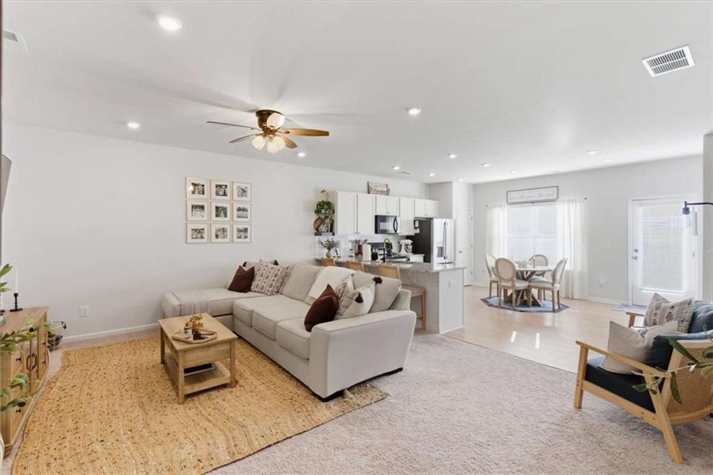 91 Pinnacle Way Jasper, GA 30143 - Photo 7 of 37 a living room with furniture and a chandelier