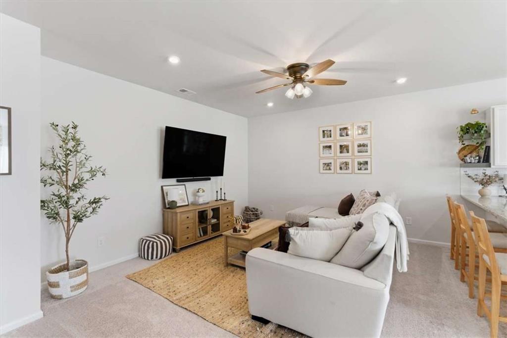 91 Pinnacle Way Jasper, GA 30143 - Photo 8 of 37 a living room with furniture and a potted plant
