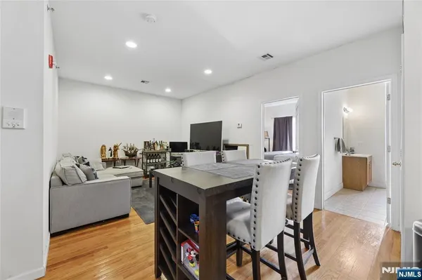 a bathroom with a granite countertop shower and a toilet