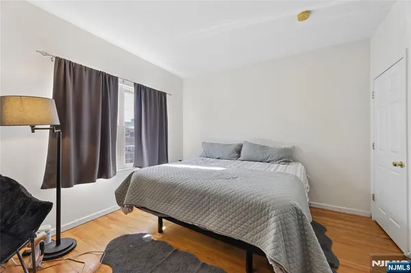 a kitchen with stainless steel appliances stove refrigerator dining table and chairs