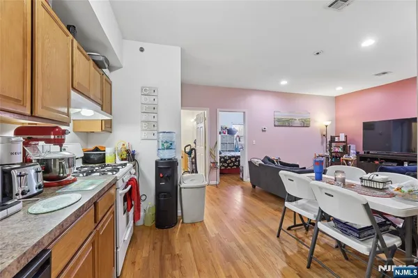 a bedroom with a bed and a television