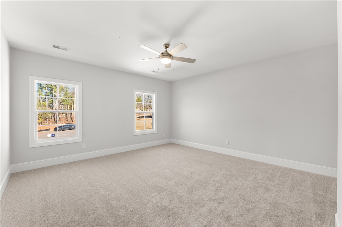 141 Rickys Path Easley, SC 29642 - Photo 34 of 40 This airy bedroom offers serene comfort with ample natural light.