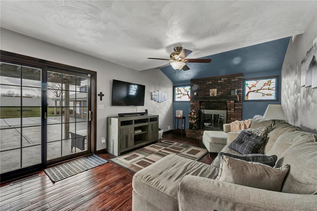 144 Wetzel Road Sarver, PA 16055 - Photo 31 of 48 a living room with furniture a flat screen tv and a floor to ceiling window