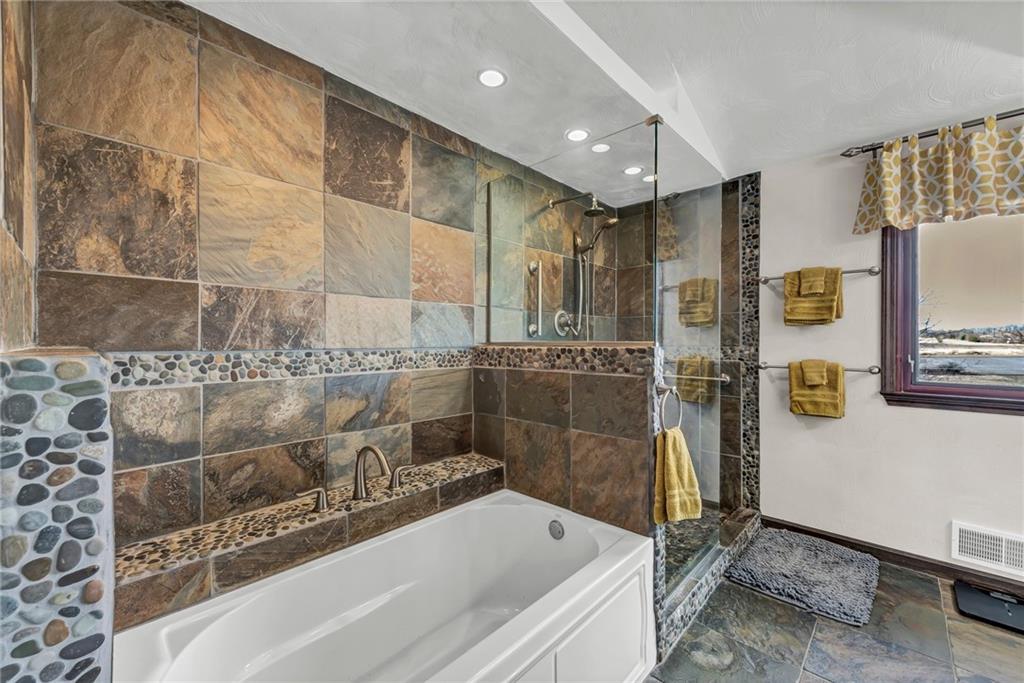 144 Wetzel Road Sarver, PA 16055 - Photo 38 of 48 a bathroom with a bathtub and a shower