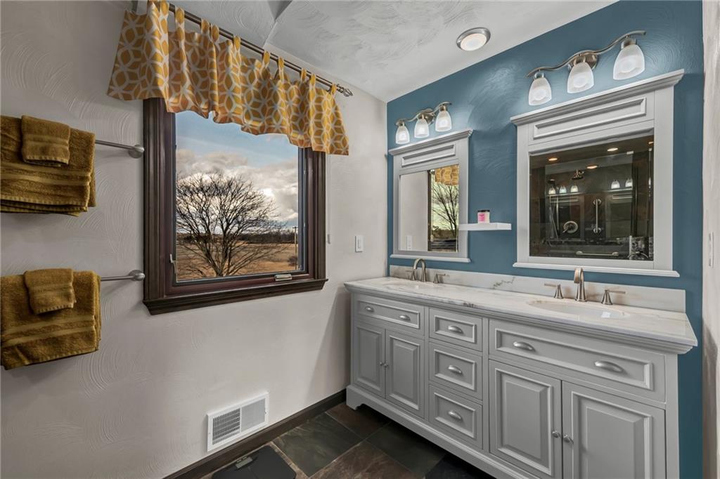 144 Wetzel Road Sarver, PA 16055 - Photo 39 of 48 a bathroom with a sink a vanity and a large mirror