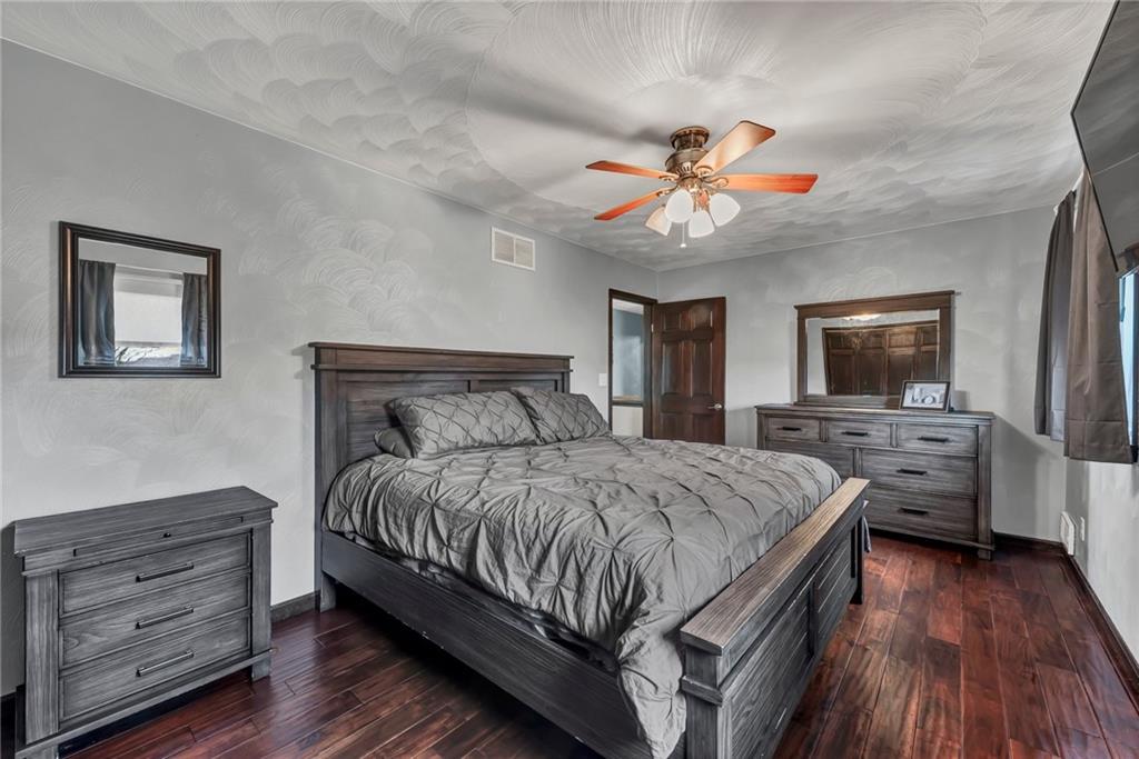 144 Wetzel Road Sarver, PA 16055 - Photo 41 of 48 a bedroom with a bed and a flat screen tv