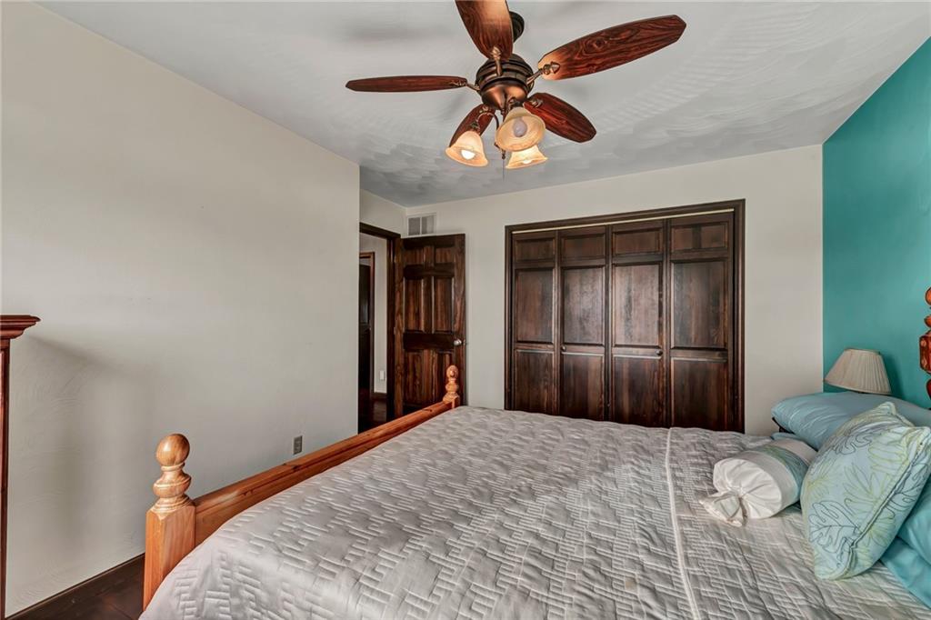 144 Wetzel Road Sarver, PA 16055 - Photo 43 of 48 a bedroom with a bed and a chandelier