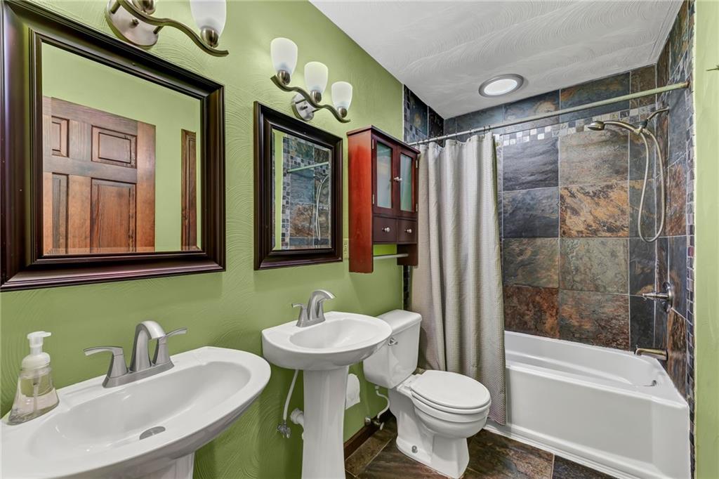 144 Wetzel Road Sarver, PA 16055 - Photo 44 of 48 a bathroom with a sink toilet mirror and shower