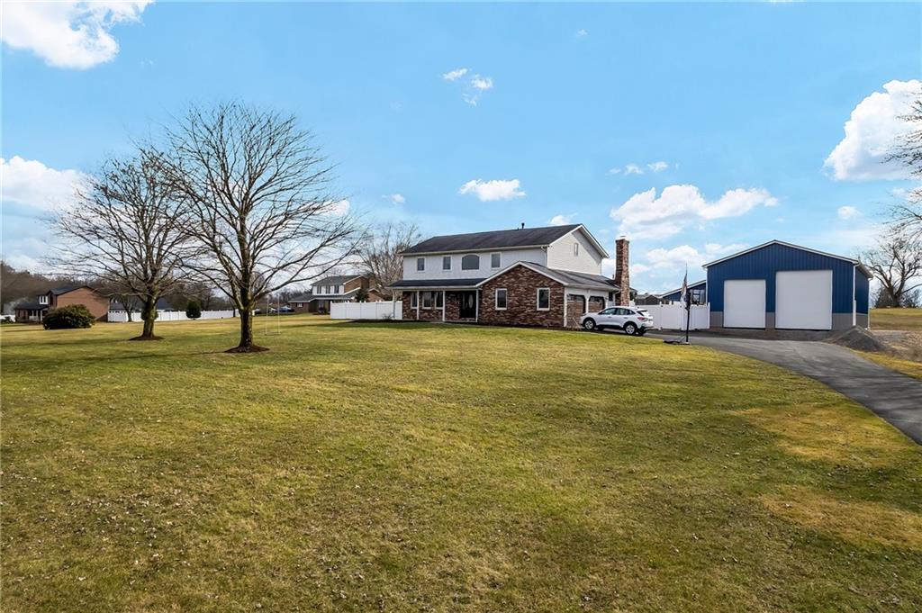 144 Wetzel Road Sarver, PA 16055 - Photo 5 of 48 a swimming pool view with a trees in the background